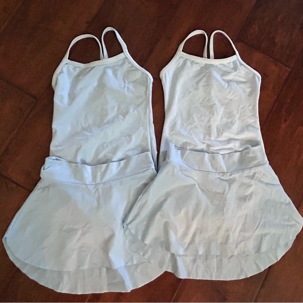 Barely worn MotionWear light blue leotard and skirt Size MC 8-10 (2 pack)